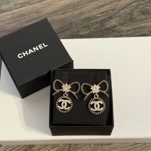 CHANEL 2025 Gold Bow Star Crystal CC Dangle Earrings